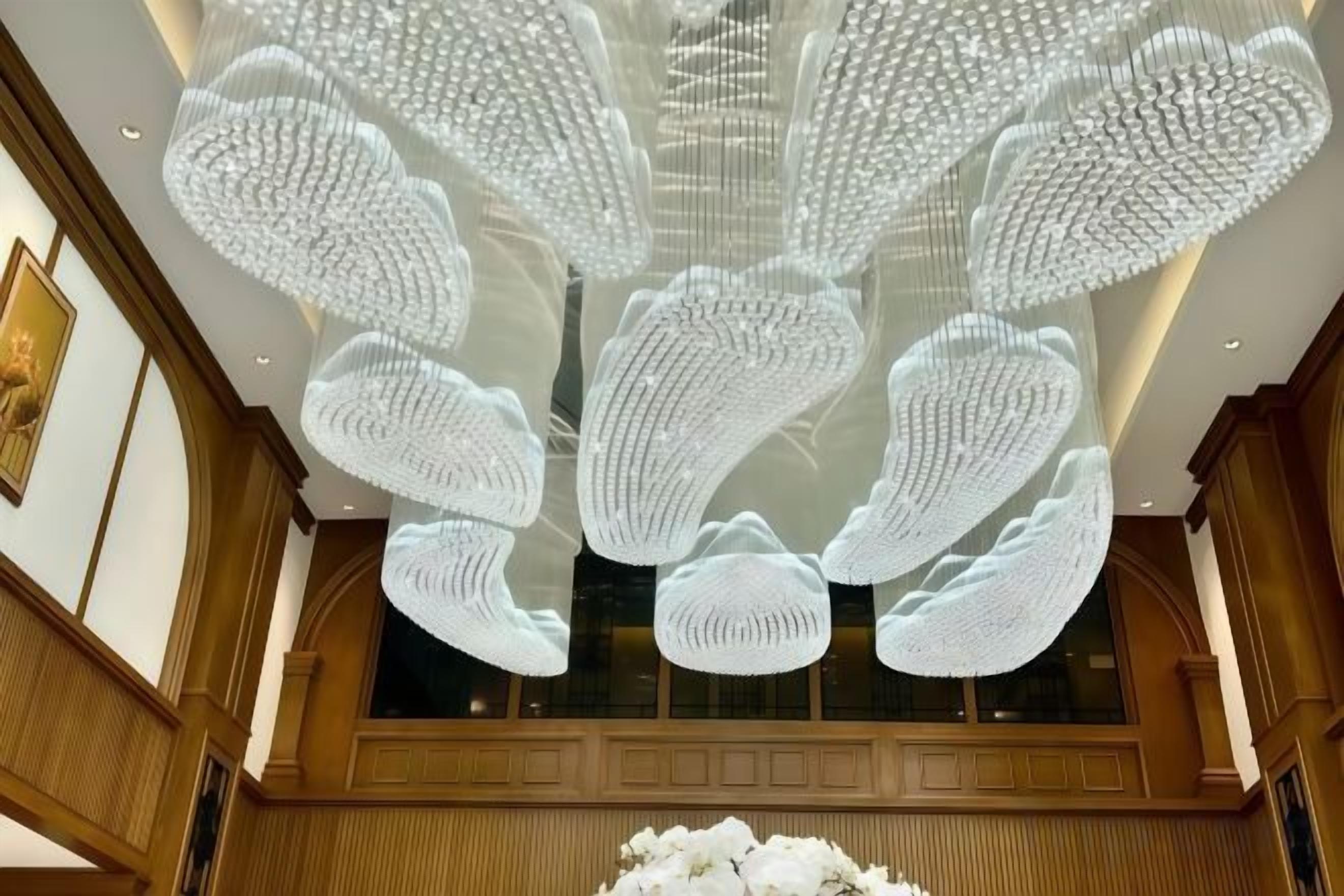 A ceiling with a large, intricate light fixture.