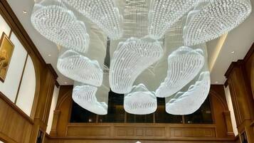 A ceiling with a large, intricate light fixture.