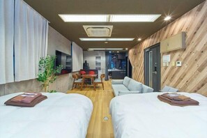 A hotel room with two beds, a dining area, and a kitchenette. - 4 min walk to Shinbashi Station, Ginza, Imperial Palace, Tokyo Tower / Max6 (Tokyo)
