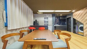 A modern kitchen with a built-in oven, a microwave, and a coffee machine. - 4 min walk to Shinbashi Station, Ginza, Imperial Palace, Tokyo Tower / Max6 (Tokyo)