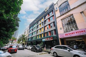 A multi-story building with commercial establishments on the ground floor, including a baby store. - Kingston Hotel 2 @ Setapak (Kuala Lumpur)