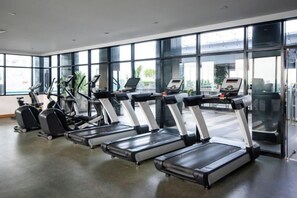 A gym with treadmills, ellipticals, and a rowing machine. - Comfy & Stylish Suasana Suites JB City, Next to Komtar JBCC (Johor Bahru)