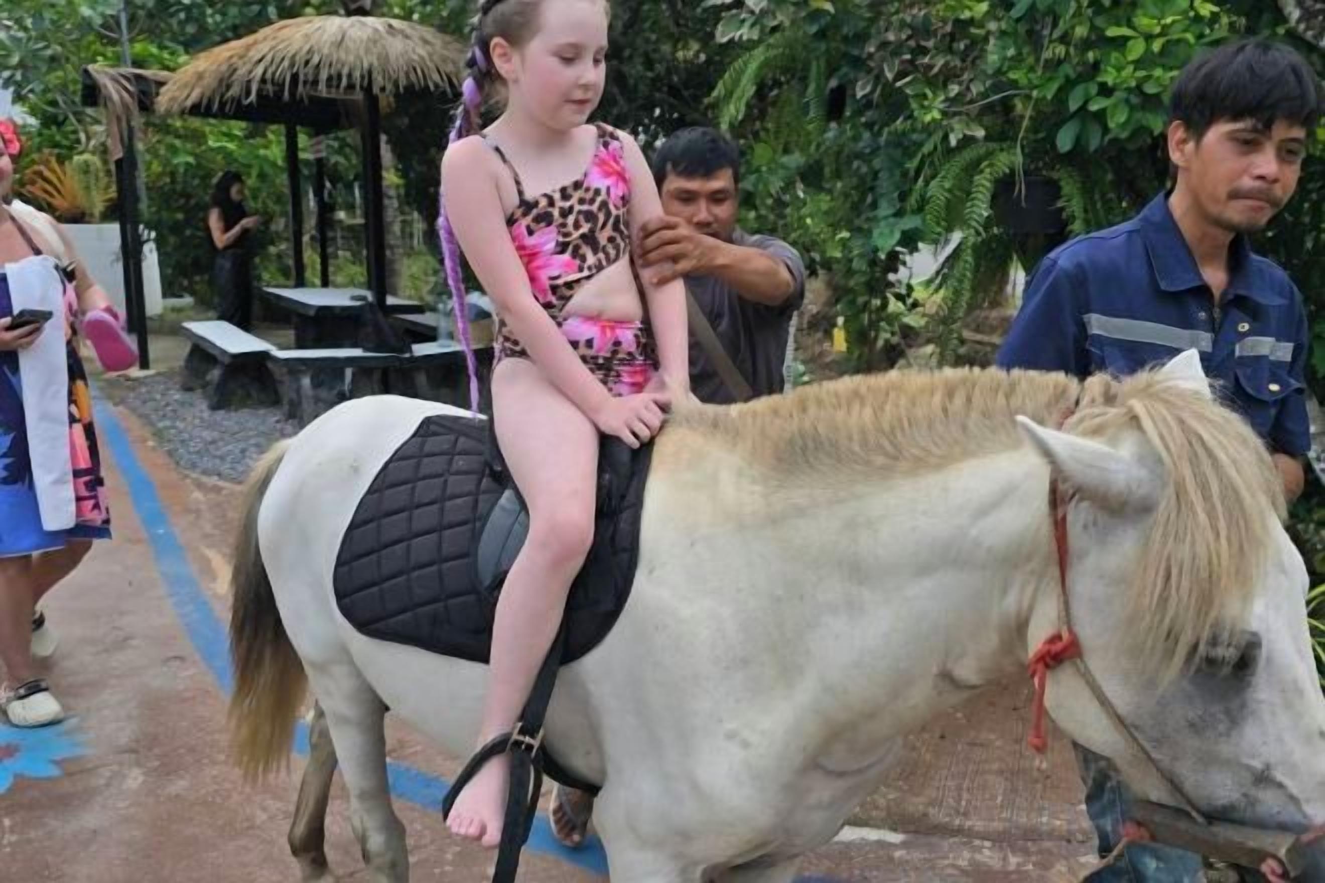 A person riding a horse with a saddle.