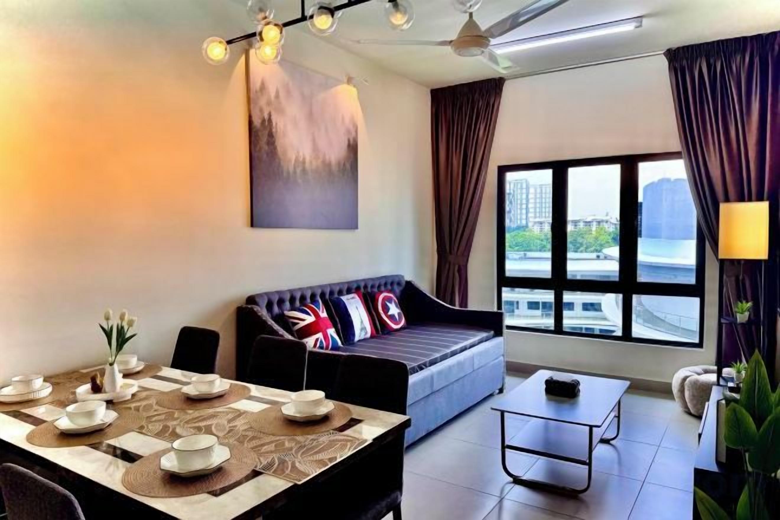 A modern living room with a sofa, dining table, and a large window with curtains.