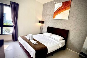 A hotel room with a bed, a window with curtains, a wall-mounted artwork, and a lamp. - 2R2B Sweet Home Cyberjaya Suites (Cyberjaya)
