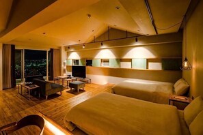 A hotel room with a large bed, a sofa, a desk, and a TV. - D-and Stay. 5 Resort Okinawa (Urasoe)