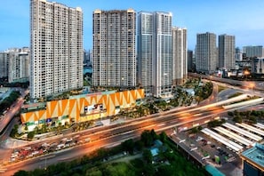 A high-rise residential building complex with multiple apartment buildings, roads, and a highway.