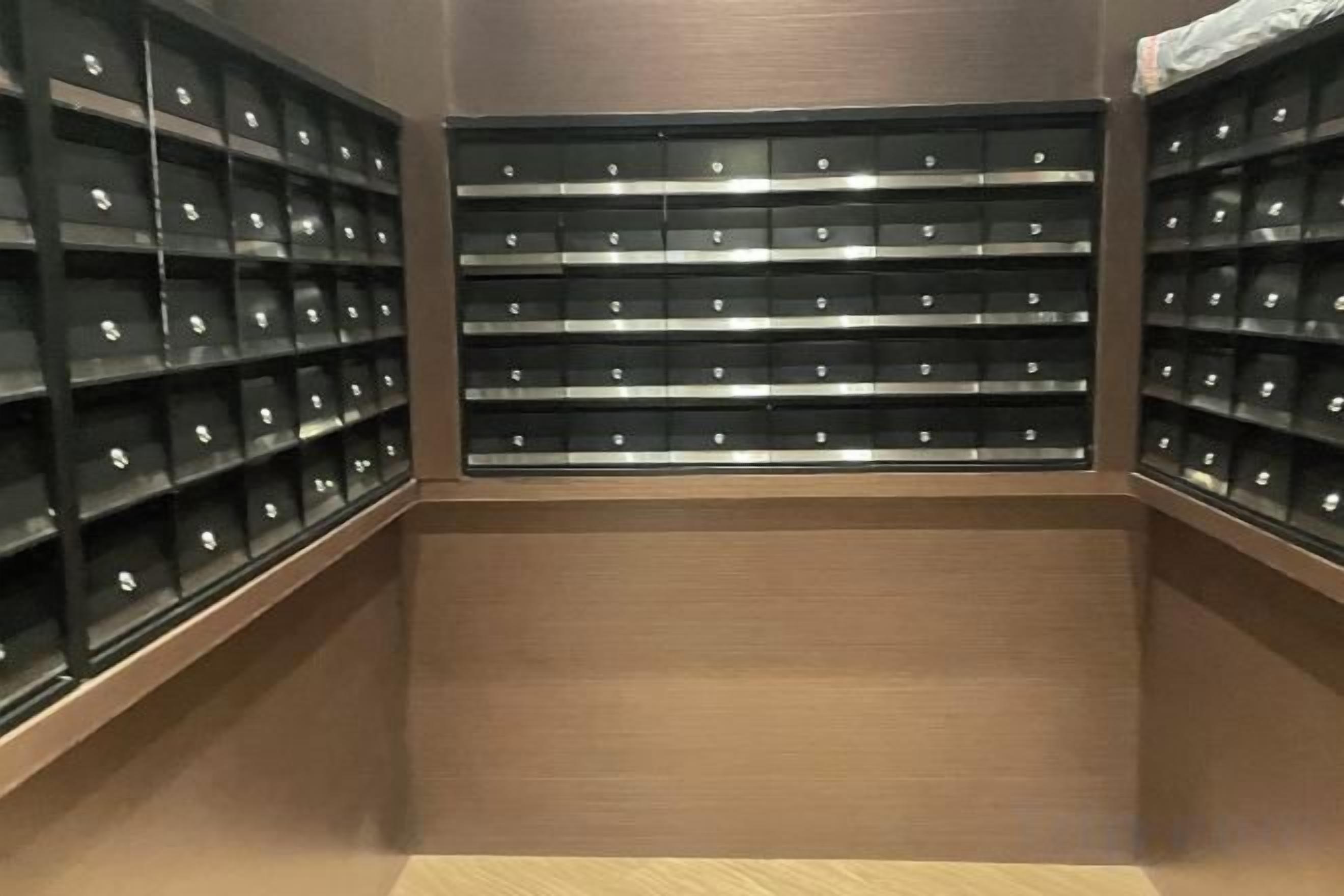A storage room with multiple shelves containing neatly organized items.