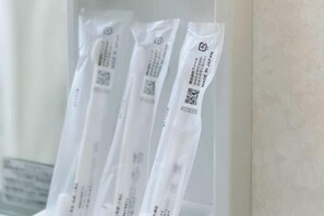 A row of transparent plastic bags with printed text and QR codes, likely for a hotel or similar establishment. - Urban Heights Watanabedori A (Fukuoka)