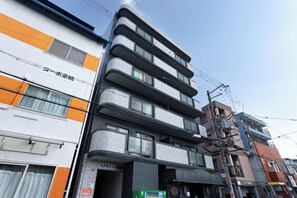 A multi-story building with a commercial ground floor and residential upper floors. - Excellence Osakajo Koen (Osaka)