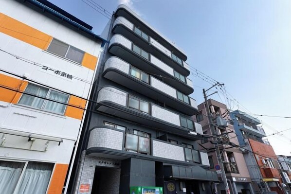 A multi-story building with a commercial ground floor and residential upper floors. - Excellence Osakajo Koen (Osaka)