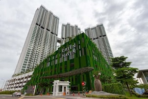 A modern building with the name 'GREEN HAVEN' prominently displayed.