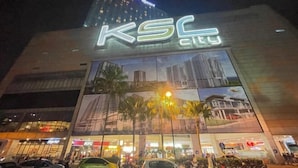A multi-story building with a prominent 'KSC City' sign.