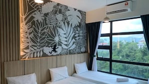 A hotel room with two beds, a floral wall mural, and a large window with a view of greenery. - Peaceful JQ homestay (Kota Kinabalu)