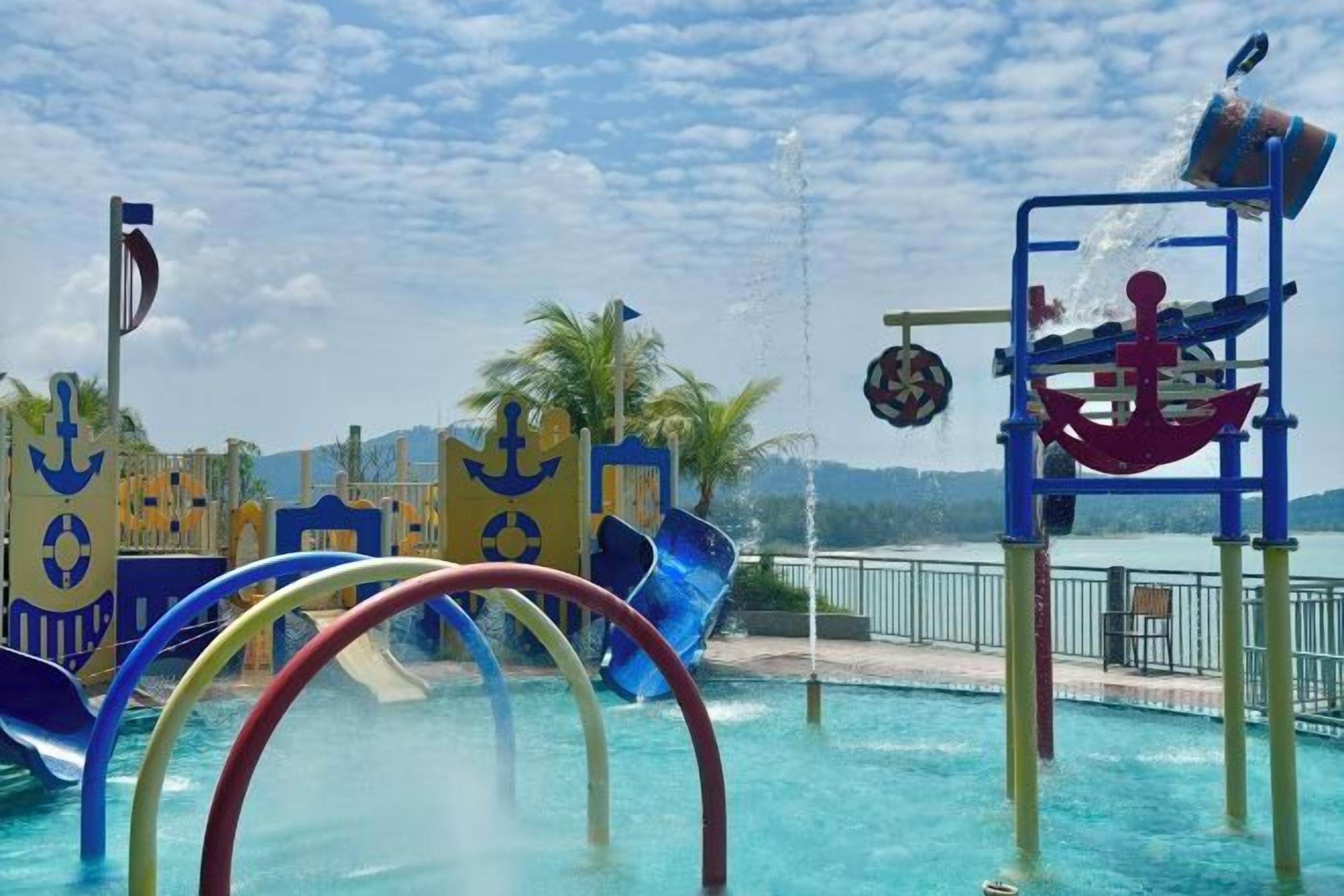 A water play area with slides and a water fountain.