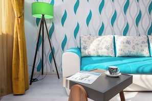 Exclusive Apartment, Balcony, City View | Living area | 108-cm Smart TV with cable channels