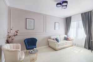 Deluxe Apartment, Balcony, City View | Living area | 108-cm Smart TV with cable channels