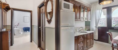 Deluxe Apartment, Balcony, City View | Private kitchen | Espresso maker, spices, cleaning supplies, freezer