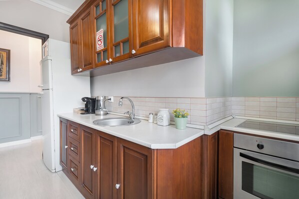 Deluxe Apartment, Balcony, City View | Private kitchen | Espresso maker, spices, cleaning supplies, freezer