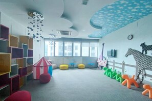 A children's playroom with colorful furniture, a striped play tent, and a horse decoration on the wall. - Homestay near to PWTC @ BY AWESOMESTAY (Kuala Lumpur)