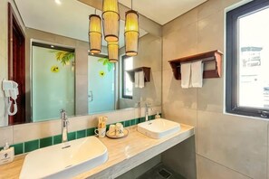 A bathroom with two sinks, a large mirror, and a window. - Dorm Tropical Hostel Da Nang by Haviland (Da Nang)