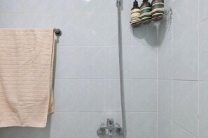 A bathroom with a towel rack, a shower head, and a soap dispenser. - Seoul Full House/Hongdae Entrance Sta.Exit 7. Party room. Big House. Two Rooms. (Seoul)