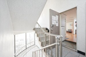 A staircase with metal railings leading to an upper floor. - Seoul Full House/Hongdae Entrance Sta.Exit 7. Party room. Big House. Two Rooms. (Seoul)