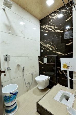 Shower, rainfall showerhead, towels, soap