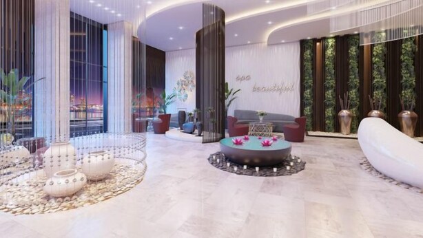 A modern lobby with a central seating area, a decorative water feature, and a wall with a vertical garden. - PQG - Vinhomes Skylake - Lavish - Resplendent Apartments in Hanoi (Hanoi)
