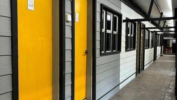 A corridor with doors, each marked with a number.