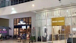 A modern building with a glass facade and a sign reading "NEXIS SOHO". - Sunway NEXIS, Kota Damansara (Petaling Jaya)