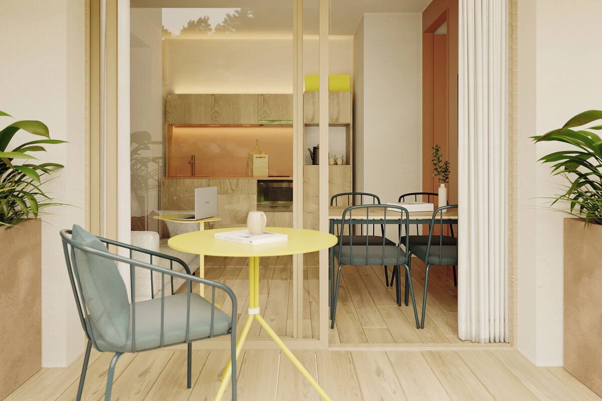 A modern dining area with a glass partition, a yellow table, and blue chairs.