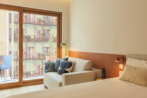 Comfort Studio, 2 Single Beds, Balcony, City View | Living area | TV