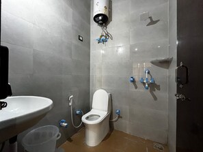 Standard Triple Room, Balcony | Bathroom | Shower, rainfall showerhead, towels, soap