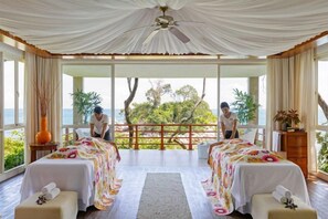 A room with two beds, a large window, and a view of the outdoors. - Club Med Bintan (Bintan)