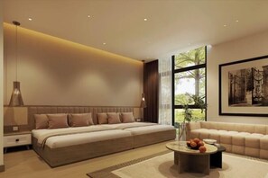 A modern bedroom with a large bed, a sofa, a coffee table, and a window with a view. - Grand Central Hotel- Vinhomes Ocean Park 3 (Nghia Tru)