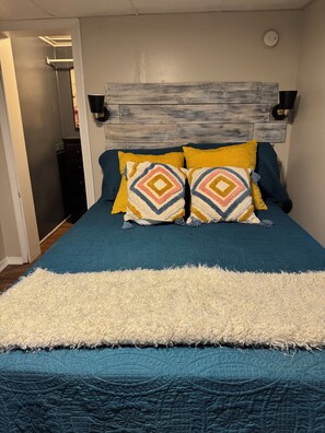 1 bedroom, desk, iron/ironing board, travel crib