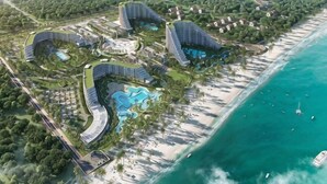 An aerial view of a resort with multiple buildings, a beach, and a swimming pool. - Sun SeaView Cam Ranh Resort (Cam Ranh)