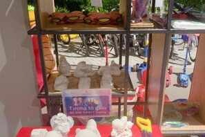 A display with various items including figurines and a sign with text. - Sun SeaView Cam Ranh Resort (Cam Ranh)