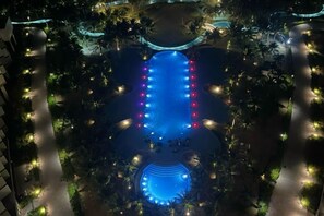 A rooftop pool with a central water feature and surrounding seating areas. - Sun SeaView Cam Ranh Resort (Cam Ranh)
