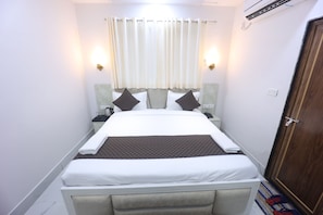 Luxury Double Room, City View | In-room safe, desk, laptop workspace, blackout drapes