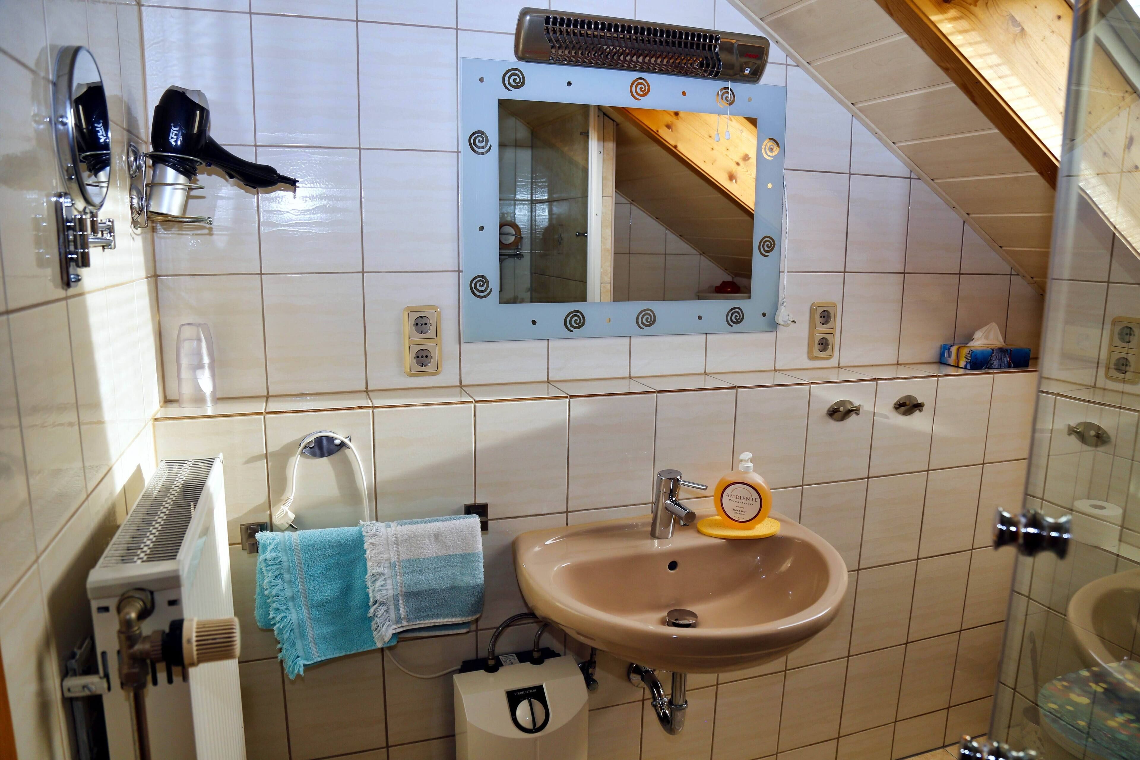 Shower, hair dryer, towels, soap