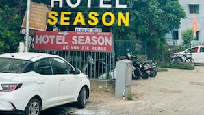 A hotel sign with "HOTEL SEASON" and "ACON A/C ROOMS" indicating air conditioning availability. - Hotel Season (Ahmedabad)
