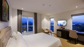 Junior Suite, Balcony, City View | In-room safe, desk, laptop workspace, blackout drapes