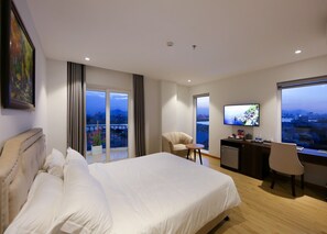 Junior Suite, Balcony, City View | In-room safe, desk, laptop workspace, blackout drapes