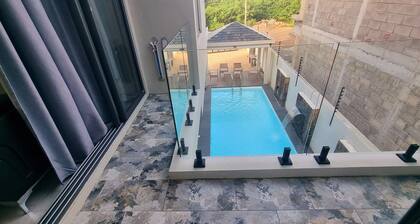 Serenity I Villa : 4 Ensuite Bedrooms, Heated Pool Feature & Cozy Living Spaces.