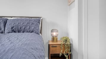 1 bedroom, desk, iron/ironing board, travel crib