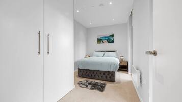 1 bedroom, desk, iron/ironing board, travel crib