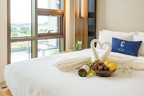 2 Bedroom Deluxe, Kitchen | In-room safe, laptop workspace, blackout drapes, iron/ironing board