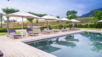 2 outdoor pools, pool umbrellas, pool loungers